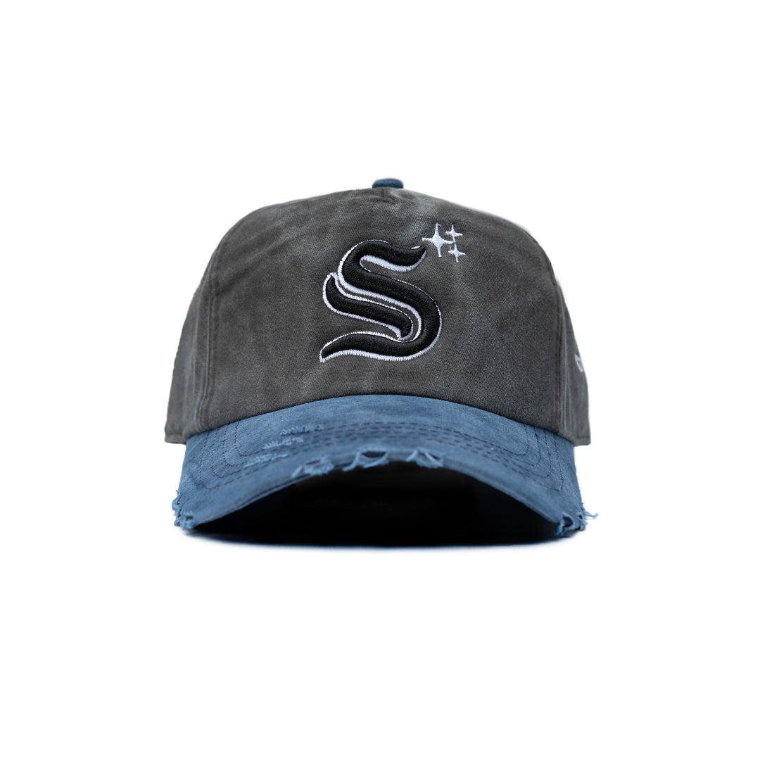Gray and blue cap with a logo on a white background
