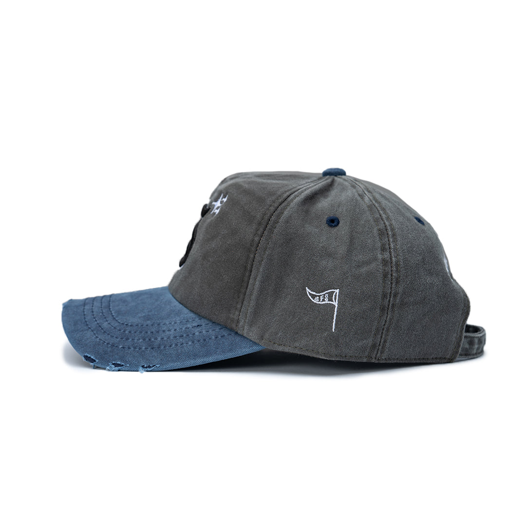 Two baseball caps, one gray and one blue, on a white background