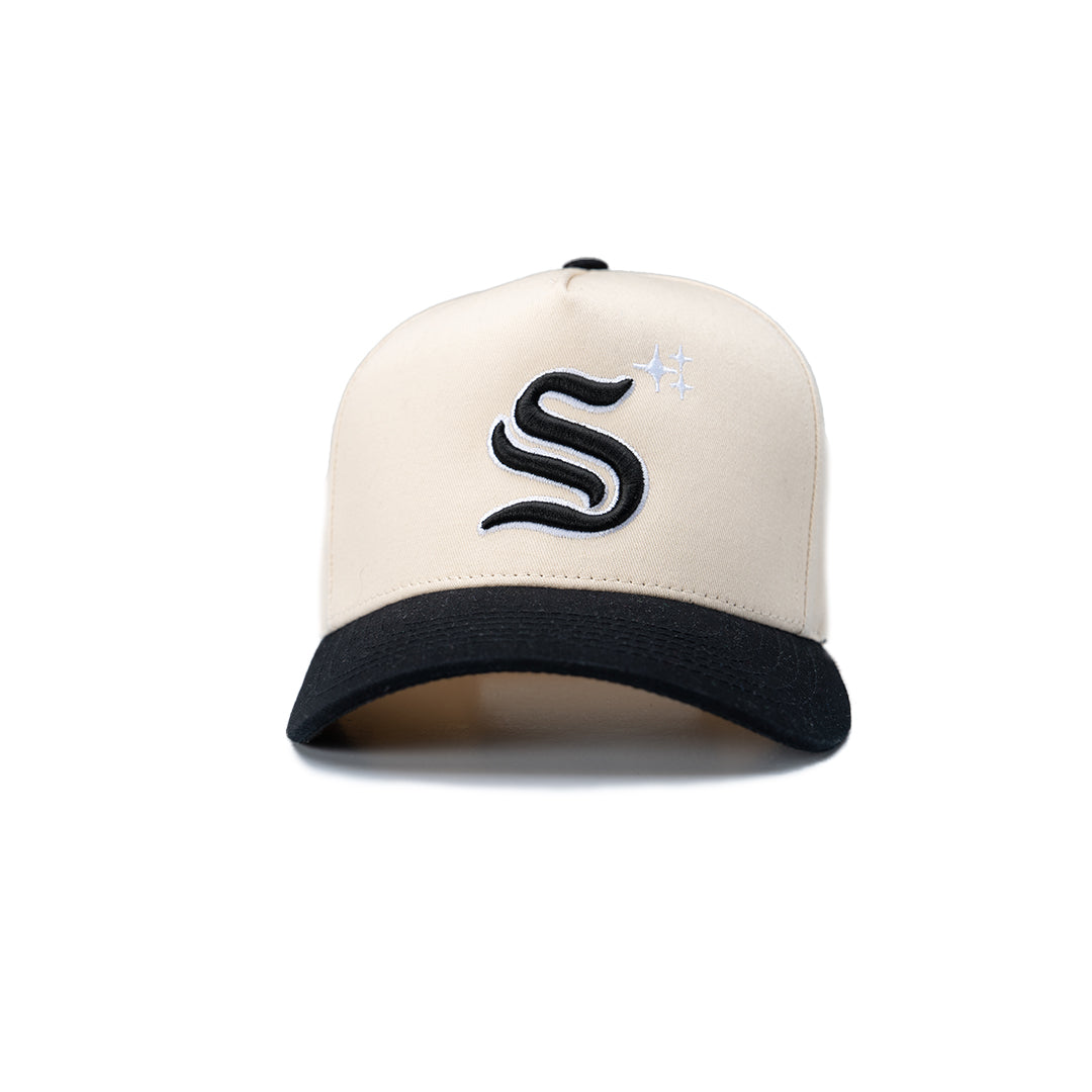Beige and black cap with a logo on a white background