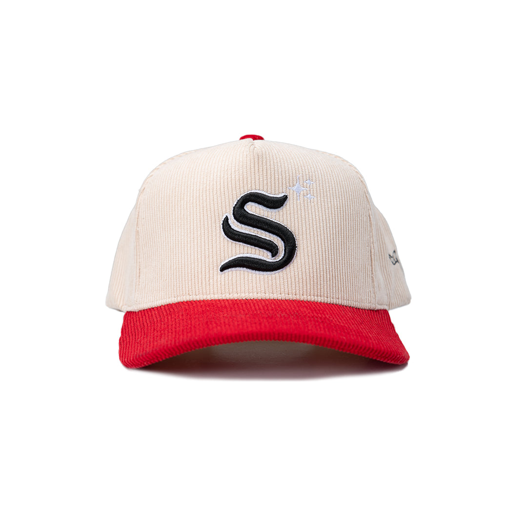 Beige and red cap with a black logo on a white background