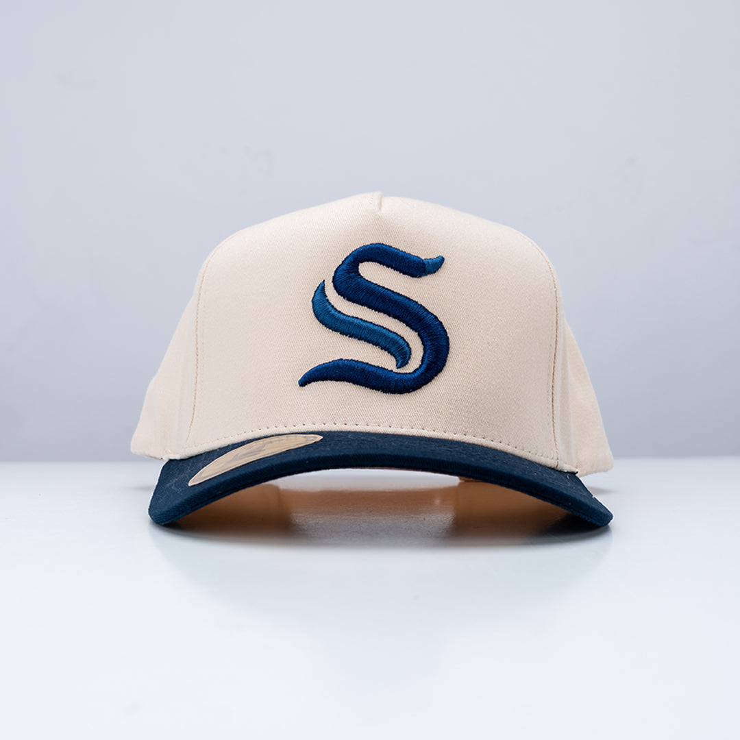Beige cap with blue logo on a light gray background