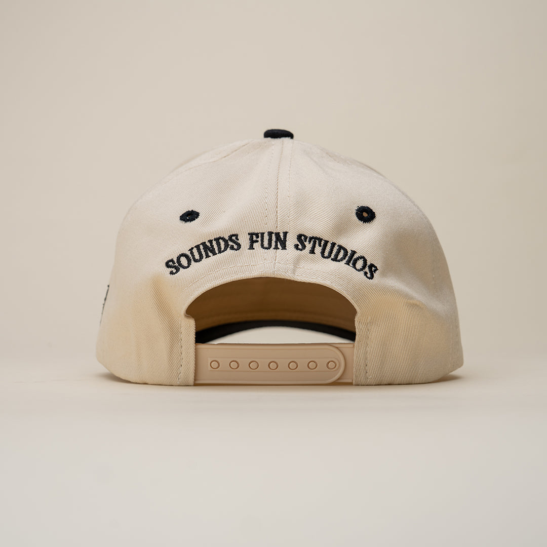 Beige cap with 'SOUNDS FUN STUDIOS' text on a beige background